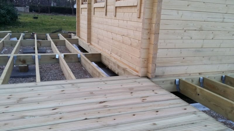 Decking boards being laid outside the Edelweiss log cabin