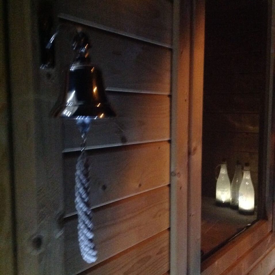 Doorbell attached to Asmund Log Cabin front door
