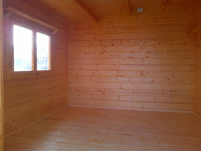 This is the basic inside of a log cabin with a floor fitted