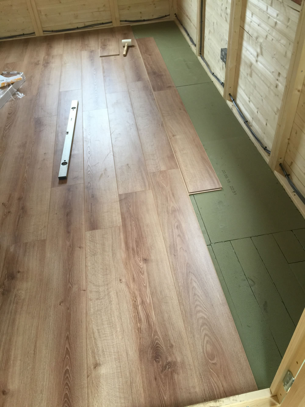 A stunning oak laminate floor fitted on top of the standard floor