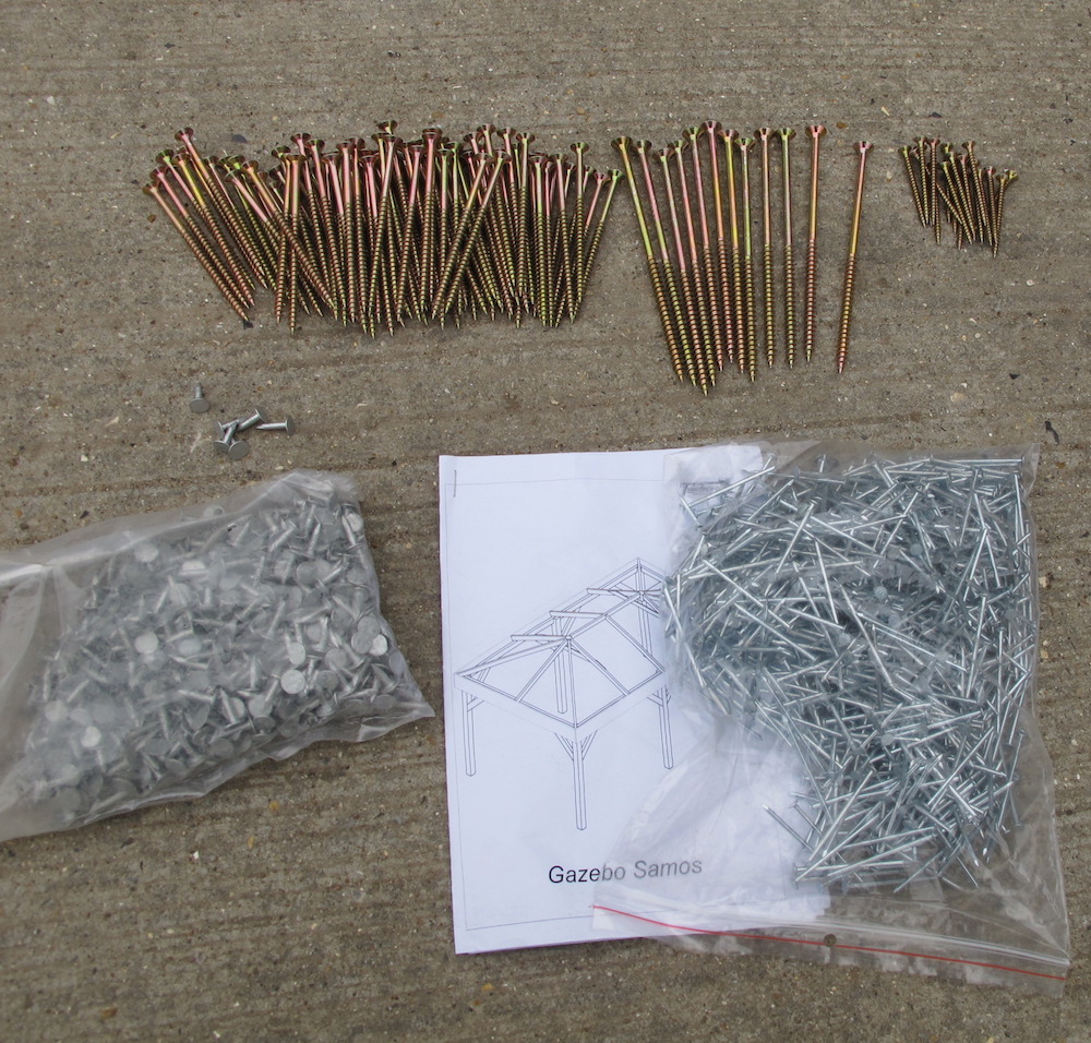 The Gazebo fitting kit. It's pretty simple, the long nails are for the thickest bits of wood, shorter ones for the thinner and the very short ones will be used for the lateral bracing slats of which there are two in a rectangular roof gazebo. Nails are supplied for the roof boards. Felt tacks are for your final roof covering.