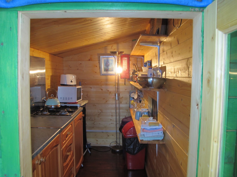 Coventry log cabin kitchen area is in the annexe to the side.