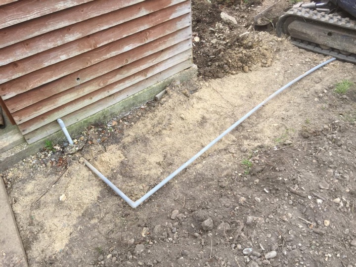 This was the supply to one of the old sheds. Plastic conduit just under the turf with twin and earth. Definitely NOT recommended!!!