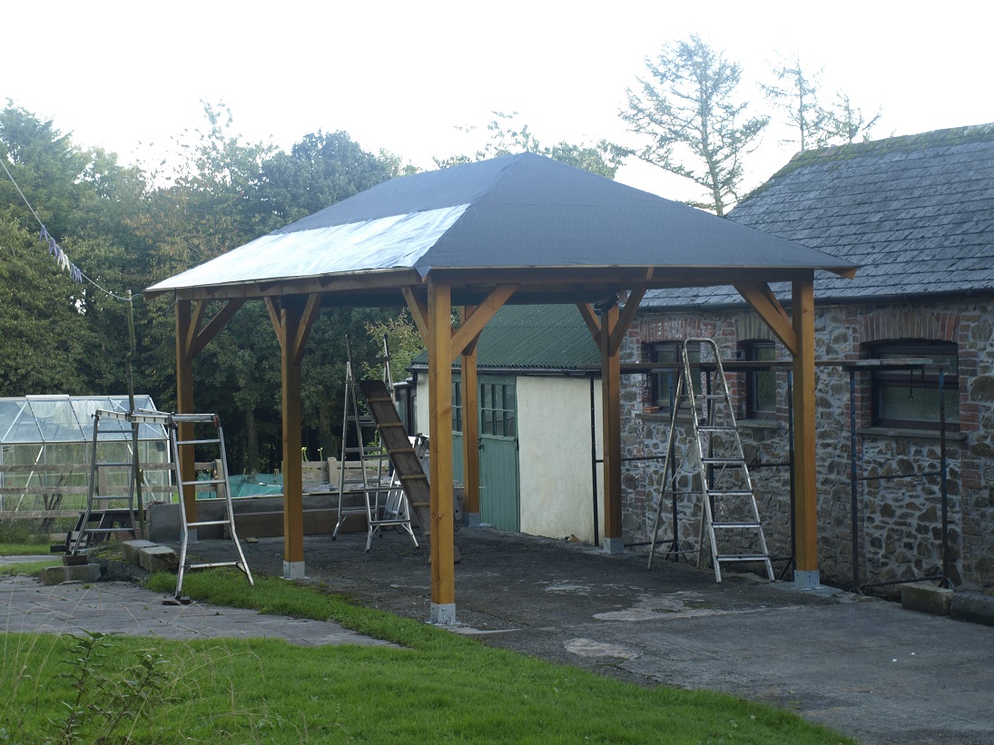 Gazebo roof shingles being fitted