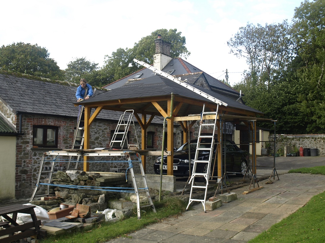 A good use of trestles and ladders to install the gazebo roof.