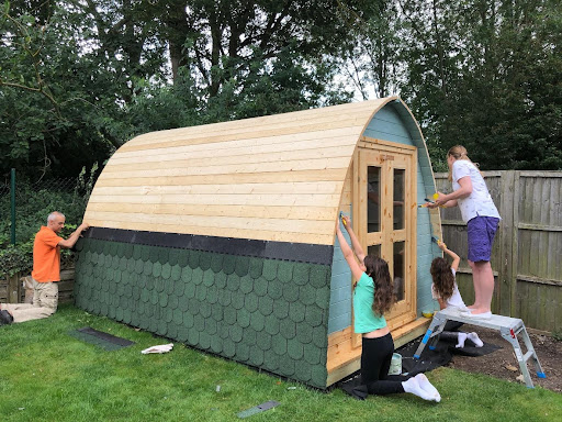 Family Building the Garden Gym Pod together