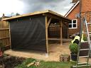 Large modern gazebo with option cloth and timber wall