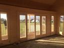 An inside view of the Olaug Log Cabin windows and doors