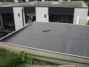 EPDM roofing material for flat roofs such as log cabins finished with the optional metal trims
