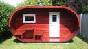 Oval log cabin sauna