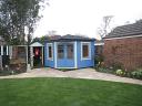 The 58mm Riina Log Cabin painted in a bright blue