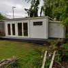 Flow log cabin studio with side annexe 