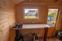 Lars 28mm log cabin with side canopy inside